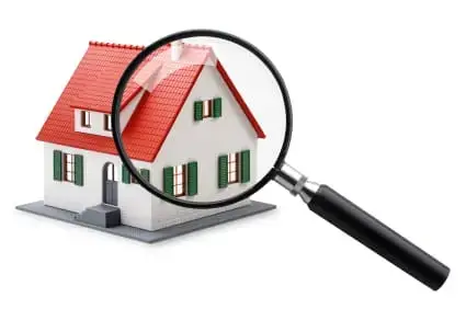 House with a red roof under a magnifying glass, representing a Temecula home search