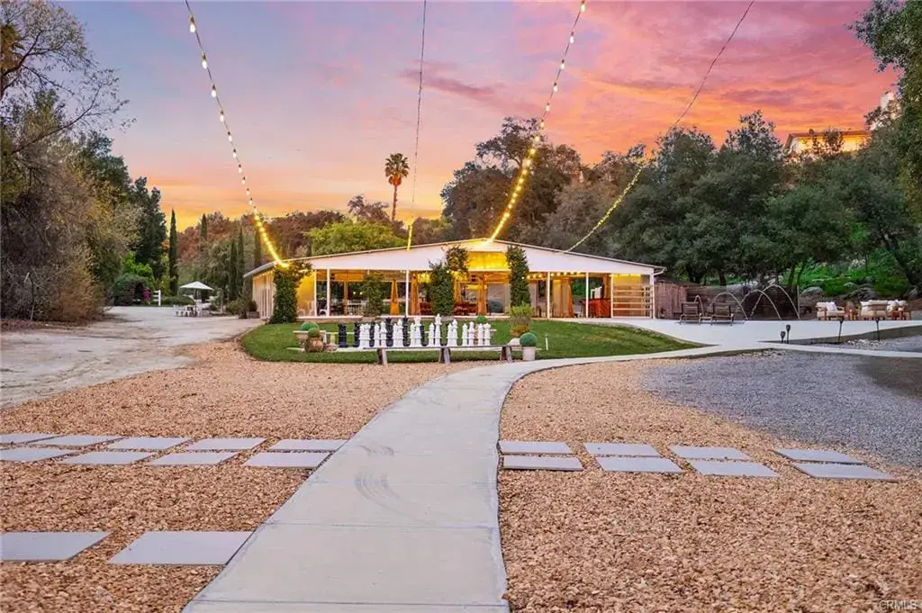 Temecula Wine Country home exterior at sunset with landscaped yard recently sold by Marchena Home Team