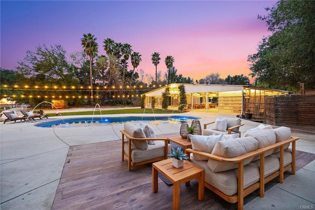 Temecula Wine Country backyard with pool and outdoor seating area at sunset recently sold by Marchena Home Team