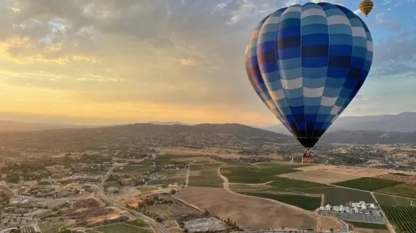 Temecula Valley hot air balloon over wine country and homes