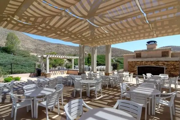 Covered clubhouse patio and barbecue area at The Oasis in Menifee