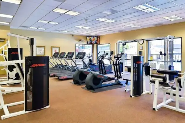 Fitness center with exercise equipment at The Oasis in Menifee