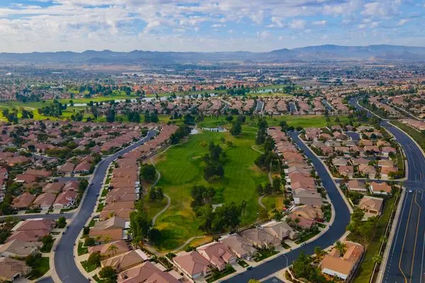 Aerial view of single-family homes and streets in The Oasis, Menifee