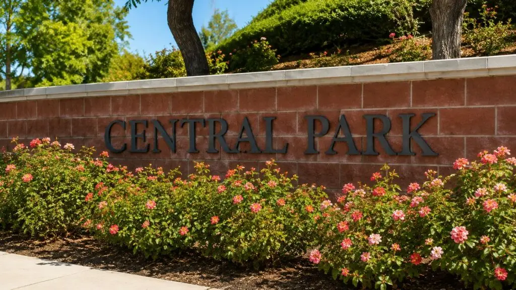 Central Park community entrance wall with rose beds in Murrieta, California
