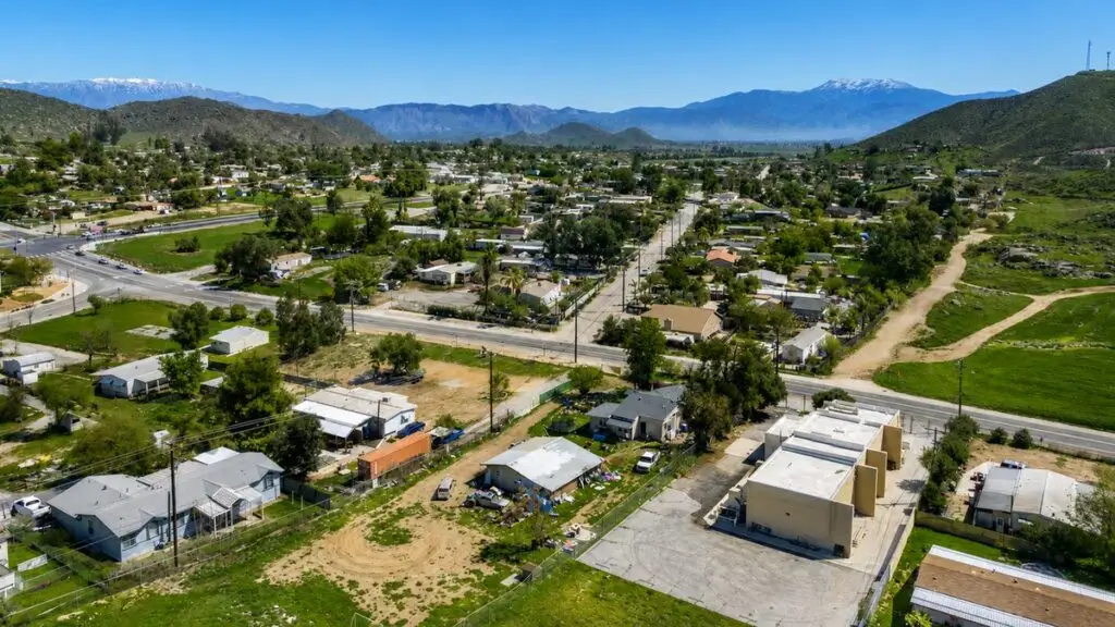 Aerial view of the Green Acres area with established homes and mountains beyond, Hemet, California