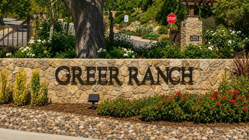 Greer Ranch stone entrance monument beneath a mature oak in Murrieta, California