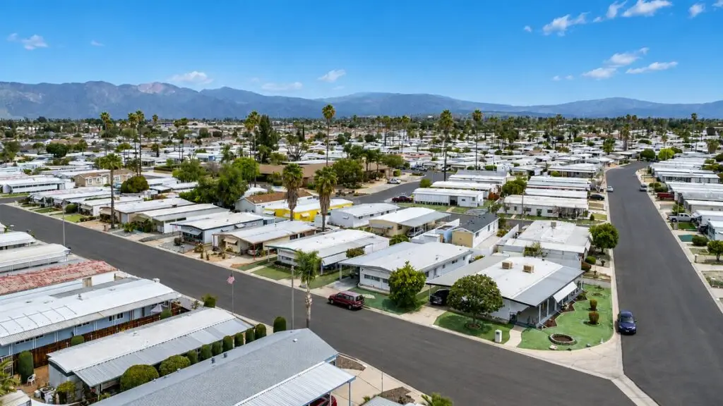 Aerial view of single-story homes and tree-lined streets in Sierra Dawn Estates, Hemet, California