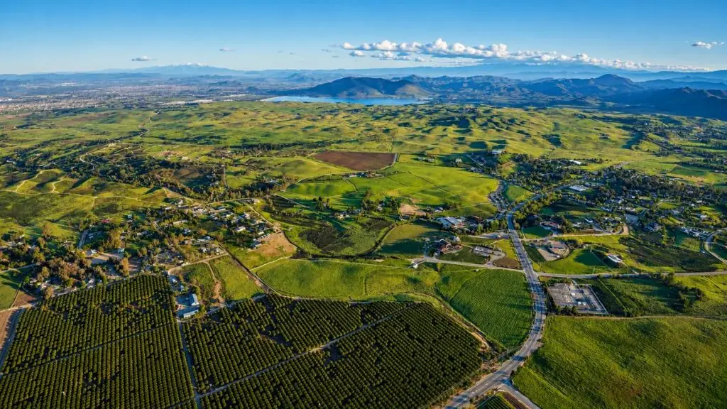 Aerial view of the rolling hills, groves and rural parcels of West Murrieta, California